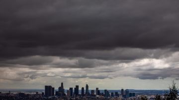 TOPSHOT - Heavy clouds are seen over downtown Los Angeles skyline from Griffth park on April 5, 2020 in Los Angeles, California. (Photo by Apu GOMES / AFP) (Photo by APU GOMES/AFP via Getty Images)