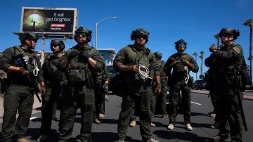 HUNTINGTON BEACH, CA - MAY 31: Huntington Beach SWAT team members stand ready for protesters after violent demonstrations in response to George Floyd's death on May 31, 2020 in Huntington Beach, California. California Governor Gavin Newsom has deployed National Guard troops to Los Angeles to curb the looting and destruction of property. Protesters have been demonstrating after video emerged of a Minneapolis police officer, Derek Chauvin, pinning Floyd's neck to the ground. Floyd was later pronounced dead while in police custody after being transported to Hennepin County Medical Center. The four officers involved in the incident have been fired and Chauvin has been arrested and charged with 3rd degree murder. (Photo by Brent Stirton/Getty Images)