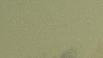 A helicopter flies above the Los Angeles downtown skyline as snow-topped mountains stand after sunrise following heavy rains as seen from the Kenneth Hahn State Recreation Area on December 29, 2020 in Los Angeles, California. (Photo by Patrick T. FALLON / AFP) (Photo by PATRICK T. FALLON/AFP via Getty Images)