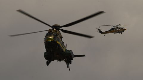 A Los Angeles Sheriff Department (LASD) Rescue 5 Super Puma helicopter circles over a burning house of a suspected gunman of a shooting at a fire station on June 1, 2021 in Acton, California. - A shooting at a fire station in Agua Dulce on Tuesday morning left one firefighter dead and another wounded, officials said. (Photo by Patrick T. FALLON / AFP) (Photo by PATRICK T. FALLON/AFP via Getty Images)