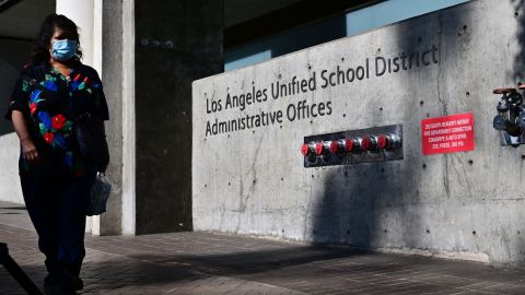 A pedestrian walks past the headquarters of the Los Angeles Unified School District on October 3, 2022 in Los Angeles, California. - LAUSD Superintendant ALberto Carvalho remains firm on Monday on his refusal to pay a ransom demanded by an international hacking syndicate, days after hacked data from the school district was posted on the dark web. A hacking syndicate known as Vice Society sent a ransom demand to the school district last week setting an October 3 deadline to pay the unspecified ransom with threats to release more hacked data online if payment is not met. (Photo by Frederic J. BROWN / AFP) (Photo by FREDERIC J. BROWN/AFP via Getty Images)