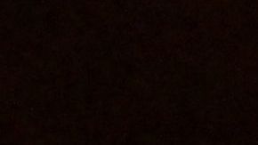 A visitor warms up herself with a candle in a studio named Ram, for its Indian owner, in Kyiv on December 20, 22022. - The women filed into the yoga studio, on the ground floor of an otherwise pitch-black apartment block, for an afterwork session that was specially tailored to Ukraine's current period of deprivation. (Photo by Sergei SUPINSKY / AFP) (Photo by SERGEI SUPINSKY/AFP via Getty Images)