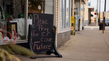 EAST PALESTINE, OH - FEBRUARY 14: A handwritten sign is on display outside a flower shop located on Market Street on February 14, 2023 in East Palestine, Ohio. A train operated by Norfolk Southern derailed on February 3, releasing toxic fumes and forcing evacuation of residents. (Photo by Angelo Merendino/Getty Images)