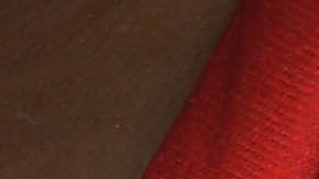 Escudo del club Rayos del Necaxa en su popular playera rojiblanca.