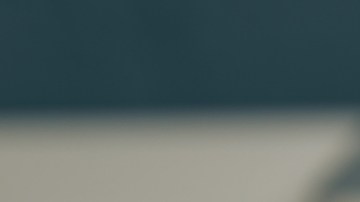 Imagen de una casa en miniatura de madera, sobre un calendario en el que está marcado el 15 con un círculo rojo y está junto a un reloj de arena y a una pluma.