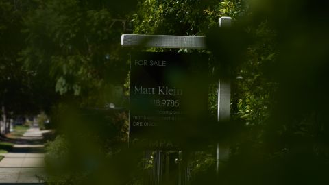 LOS ANGELES, CA - SEPTEMBER 22: A 'for sale' sign is displayed outside a single family home on September 22, 2022 in Los Angeles, California. The U.S. housing market is seeing a slow down in home sales due to the Federal Reserve raising mortgage interest rates to help fight inflation. (Photo by Allison Dinner/Getty Images)