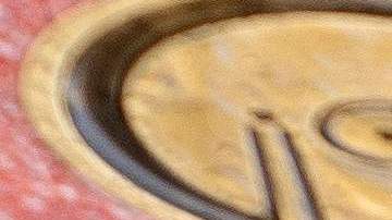 A pedestrian carrying an umbrella is reflected in water along the Hollywood Walk of Fame in Hollywood, California, on January 10, 2023. (Photo by Stefani Reynolds / AFP) (Photo by STEFANI REYNOLDS/AFP via Getty Images)