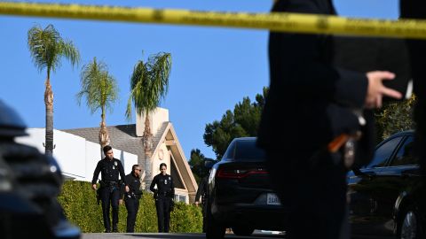 Law enforcement work an investigation of an early morning shooting that left three people dead and four wounded in the Beverly Crest neighborhood of Los Angeles, just north of Beverly Hills, on January 28, 2023. - Three people were shot dead January 28 and four others injured at a luxury home near Beverly Hills, at what US police described as a gathering at a short-term rental property. (Photo by Robyn BECK / AFP) (Photo by ROBYN BECK/ AFP/AFP via Getty Images)