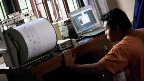 A geologist prepares his instruments to monitor the eruption of Mount Sinabung at their base in Surbakti village, Tanah Karo in North Sumatra on September 1, 2010. Thousands of Indonesians will spend their fourth day in evacuation centers as the volcano threatened a devastating eruption on Sumatra island, officials said. The mountain erupted for the first time in 400 years on August 29, 2010. AFP PHOTO / Bay ISMOYO (Photo by BAY ISMOYO / AFP) (Photo by BAY ISMOYO/AFP via Getty Images)