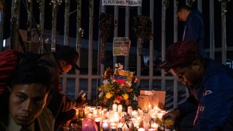 Migrants light candles during a vigil outside Mexican immigration facilities where at least 38 migrants died in a fire, in Ciudad Juarez, Chihuahua state, on March 28, 2023, Mexico. - A fire believed to have been started by migrants protesting against their deportation killed at least 38 people at a Mexican immigration detention center near the US border, authorities said on March 28, 2023, prompting demands for justice. The blaze broke out late March 27 at the National Migration Institute (INM) facility in Ciudad Juarez, prompting the mobilization of firefighters and dozens of ambulances. (Photo by Guillermo Arias / AFP) (Photo by GUILLERMO ARIAS/AFP via Getty Images)