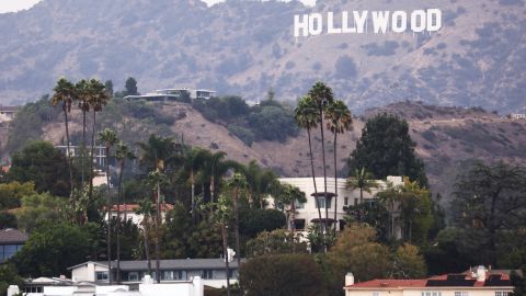 LOS ANGELES, CALIFORNIA - OCTOBER 07: The Hollywood sign is viewed above homes in the Hollywood Hills on October 07, 2021 in Los Angeles, California. The IATSE union which represents Hollywood’s film and television production crews voted to authorize a strike, calling for better working conditions and higher pay amid a surge in streaming demand. Negotiations are ongoing but a strike may be imminent. (Photo by Mario Tama/Getty Images)