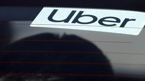 LOS ANGELES, CALIFORNIA - FEBRUARY 08: A passenger sits in an Uber rideshare vehicle at Los Angeles International Airport (LAX) on February 8, 2023 in Los Angeles, California. Ride-hailing giant Uber has beaten estimates with a strong revenue and adjusted earnings report with quarterly revenue hitting $8.6 billion, 49 percent higher than the same period last year. (Photo by Mario Tama/Getty Images)