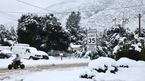 GREEN VALLEY, CALIFORNIA - FEBRUARY 25: A person drives an ATV through the snow in Los Angeles County, in the Sierra Pelona Mountains, on February 25, 2023 in Green Valley, California. A major storm, carrying a rare blizzard warning for parts of Southern California, is delivering heavy snowfall to the mountains with some snowfall expected to reach lower elevations in Los Angeles County. The National Weather Service has called the storm 'one of the strongest ever' to impact southwest California as it has also delivered widespread heavy rains and high winds. (Photo by Mario Tama/Getty Images)