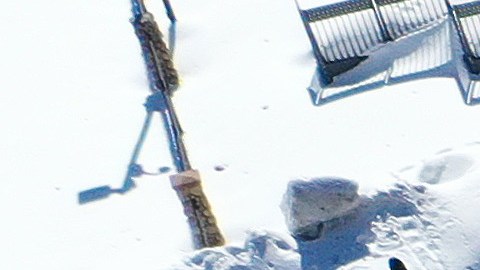 CRESTLINE, CALIFORNIA - MARCH 03: An aerial view of residents (L) waiting in line to receive donated food outside the local grocery store (R), which was severely damaged when its roof collapsed under the weight of several feet of snow, after a series of winter storms in the San Bernardino Mountains in Southern California on March 3, 2023 in Crestline, California. Some residents have been stranded in Crestline more than a week due to heavy snowfall while the grocery store was the main hub for food purchases in town. California Governor Gavin Newsom has declared a state of emergency due to winter storms for 13 counties including San Bernardino County and the California National Guard is assisting relief efforts in the mountains. (Photo by Mario Tama/Getty Images)