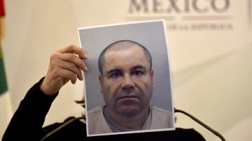 Mexico's Attorney General Arely Gomez shows a picture of Mexican drug kingpin Joaquin "El Chapo" Guzman during a press conference held at the Secretaria de Gobernacion in Mexico City, on July 13, 2015. Guzman managed to escape from his cell despite a monitoring bracelet and 24-hour security camera surveillance, and likely was helped by prison officials, authorities said Monday. AFP PHOTO/YURI CORTEZ (Photo credit should read YURI CORTEZ/AFP via Getty Images)