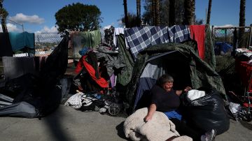 LOS ANGELES, CA - JANUARY 24: Lisa Rogers, a homeless woman, packs up to relocate her camp on January 24, 2017 in Los Angeles, California. According to a 2016 report by the U.S. Department of Housing and Urban Development, Los Angeles has the highest number of homeless people in the nation with close to 13,000 living on the streets. The annual Greater Los Angeles Homeless Count begins today and will continue through Thursday. (Photo by Justin Sullivan/Getty Images)