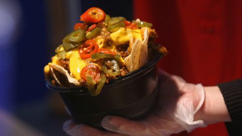 MILWAUKEE - APRIL 10: A worker prepares nachos for a customer before the Opening Day game between the Milwaukee Brewers and the Chicago Cubs on April 10, 2009 at Miller Park in Milwaukee, Wisconsin. (Photo by Jonathan Daniel/Getty Images)