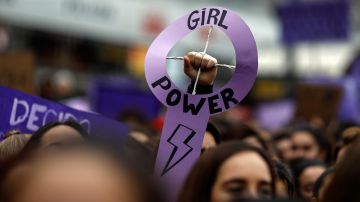 Demonstrators attend a protest at the Puerta del Sol square during a one day strike to defend women's rights on International Women's Day in Madrid, on March 8, 2018. Spain celebrated International Women's Day today with an unprecedented general strike in defence of their rights that saw hundreds of trains cancelled and countless protests scheduled throughout the day. / AFP PHOTO / OSCAR DEL POZO (Photo credit should read OSCAR DEL POZO/AFP via Getty Images)