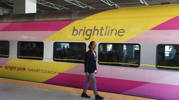 MIAMI, FL - MAY 11: Chad Simo, a train attendant, prepares to board the Brightline passenger train at the new MiamiCentral terminal for the inaugural trip from Miami to West Palm Beach on May 11, 2018 in Miami, Florida. Brightline welcomed the media, politicians and other dignitaries to ride on the inaugural trip for the privately funded passenger train which is running from Miami to West Palm Beach with one stop in Fort Lauderdale. The $3.1 billion project, will eventually extend its rail system to Orlando International Airport and is scheduled to be completed by January 2021. (Photo by Joe Raedle/Getty Images)