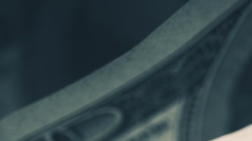 Imagen de varios billetes de dólares.