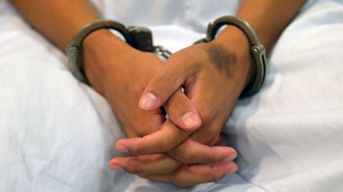 A handcuffed suspected member of the Mara 18 who remains under custody, is seen at Isidro Menendez Justice Court in San Salvador, on February 06, 2020. - Violent gangs operating in El Salvador are in retreat due to police and military operations, and the number of homicides and confrontations committed by their members has decreased, analysts said. (Photo by MARVIN RECINOS / AFP) (Photo by MARVIN RECINOS/AFP via Getty Images)