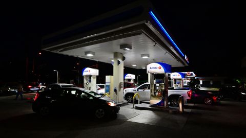 Cars pull in to fill their tanks at an Arco gas station displaying the price per gallon at over $6 in Monterey Park, California on June 22, 2022. - Joe Biden pitched a temporary fuel tax break June 22, 2022 to help American drivers face the highest inflation in four decades, but critics called it window dressing by an unpopular US president ahead of difficult midterm elections. (Photo by Frederic J. BROWN / AFP) (Photo by FREDERIC J. BROWN/AFP via Getty Images)