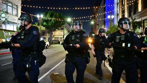 Police holding batons move to disperse a crowd of abortion rights activists protesting after the overturning of Roe Vs. Wade by the US Supreme Court, in Downtown Los Angeles, on June 24, 2022. - The US Supreme Court on Friday struck down the right to abortion in a seismic ruling that shredded five decades of constitutional protections and prompted several right-leaning states to impose immediate bans on the procedure. (Photo by Frederic J. BROWN / AFP) (Photo by FREDERIC J. BROWN/AFP via Getty Images)