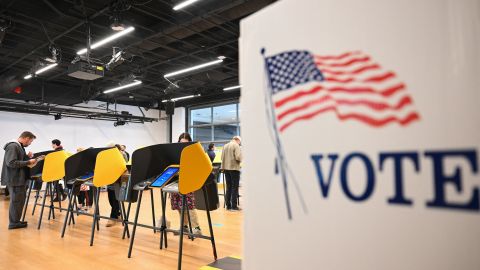 People cast ballots on electronic voting machines for the midterm election during early voting ahead of Election Day inside a vote center at the Hammer Museum in Los Angeles, California on November 7, 2022. (Photo by Patrick T. FALLON / AFP) (Photo by PATRICK T. FALLON/AFP via Getty Images)