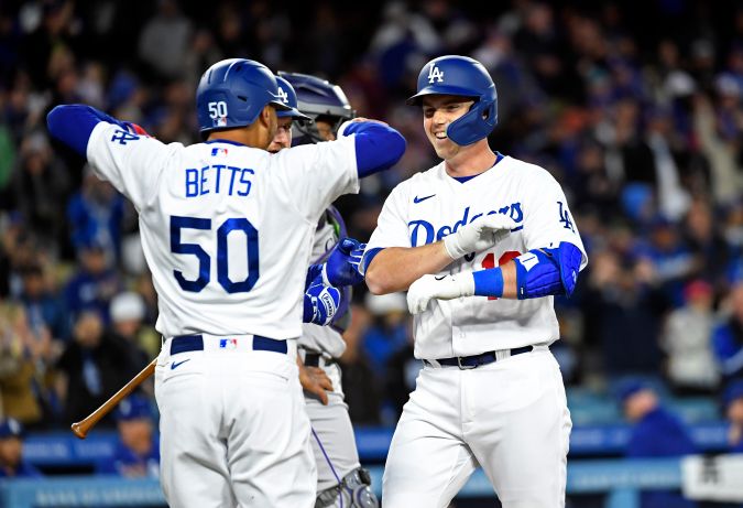 LOS ANGELES, CA - APRIL 04: Will Smith #16 of the Los Angeles Dodgers is congratulated at home plate by Mookie Betts #50 after hitting a two-run home run against starting pitcher German Marquez #48 of the Colorado Rockies during the first inning at Dodger Stadium on April 4, 2023 in Los Angeles, California. (Photo by Kevork Djansezian/Getty Images)