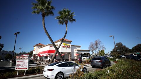 PLEASANT HILL, CALIFORNIA - OCTOBER 28: Cars line up in the drive thru at an In-n-Out restaurant on October 28, 2021 in Pleasant Hill, California. Contra Costa county health officials shut down an In-n-Out restaurant in Pleasant Hill on Tuesday after the popular burger chain ignored repeated warnings to check the vaccination cards of customers who wanted to dine indoors. San Francisco health officials shut down the Fisherman's Wharf location for several days earlier in the month for the same issue. That location is currently only offering to go orders. (Photo by Justin Sullivan/Getty Images)