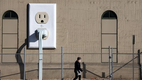 PETALUMA, CALIFORNIA - JANUARY 26: A pedestrian walks by a Pacific Gas & Electric (PG&E) electrical substation on January 26, 2022 in Petaluma, California. The Department of Homeland Security (DHS) is warning that domestic extremists have been developing specific plans to target electrical infrastructure in the United States. (Photo by Justin Sullivan/Getty Images)