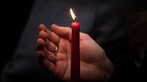 MELBOURNE, AUSTRALIA - NOVEMBER 02: People hold candles during a vigil held for Cassius Turvey at the Aboriginal Advancement League on November 02, 2022 in Melbourne, Australia. Cassius Turvey, 15, died in a Perth hospital last Sunday after he was violently assaulted in Middle Swan. Turvey was walking in the area with friends when he was assaulted. His death has triggered a wave of outrage across Australia, with many vigils and memorials taking place in several cities demanding justice. (Photo by Darrian Traynor/Getty Images)