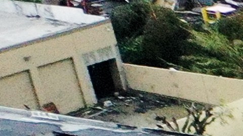 MONTEBELLO, CALIFORNIA - MARCH 22: An aerial view of roof damage after a possible rare tornado touched down and ripped up building roofs in a Los Angeles suburb on March 22, 2023 in Montebello, California. Another Pacific storm has been pounding California with heavy rain, high winds, and snow in higher elevatio. (Photo by Mario Tama/Getty Images)