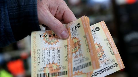 JANUARY 13: A customer holds a handful of Powerball tickets at Kavanagh Liquors on January 13, 2016 in San Lorenzo, California. Dozens of people lined up outside of Kavanagh Liquors, a store that has had several multi-million dollar winners, to -purchase Powerball tickets in hopes of winning the estimated record-breaking $1.5 billion dollar jackpot. (Photo by Justin Sullivan/Getty Images)