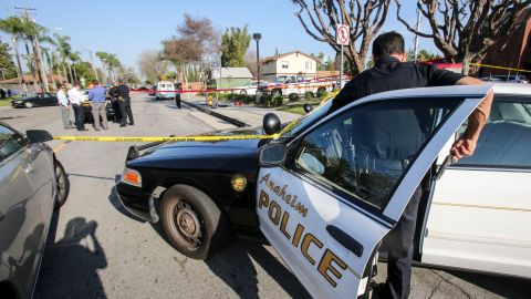 Police officers investigate the scene near Pearson Park in Anaheim, California, February 27, 2016, after three counter-protesters were stabbed while clashing with Ku Klux Klan members staging a rally. Thirteen people were arrested. / AFP / RINGO CHIU (Photo credit should read RINGO CHIU/AFP via Getty Images)