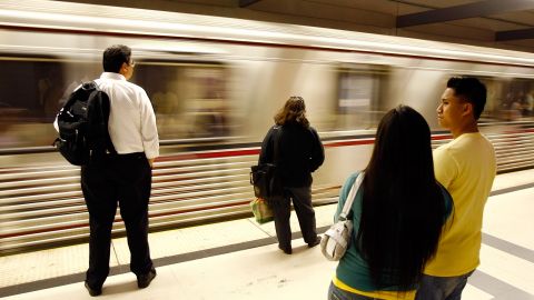 LOS ANGELES, CA - JUNE 3: Passengers wait for Metro Rail subway trains during rush hour June 3, 2008 in Los Angeles, California. Skyrocketing gas prices are driving more commuters to take trains and buses to work instead of their cars. In the first three months of 2008, the number of trips taken on public transport in the US rose 3 percent to 2.6 billion, creating pressures on some transportation systems to cope with increasing ridership. Transit officials in southern California and elsewhere are now encouraging employers to stagger employee schedules to ease the rush hour crunch on trains and buses and Metrolink plans to add 107 rail cars to its fleet of 155 as soon as next year. (Photo by David McNew/Getty Images)