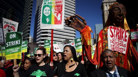 OAKLAND, CALIFORNIA - FEBRUARY 21: Oakland Unified School District students, teachers and parent carry signs as they march to the Oakland Unified School District headquarters on February 21, 2019 in Oakland, California. Nearly 3,000 teachers in Oakland have gone on strike and are demanding a 12 percent retroactive raise. (Photo by Justin Sullivan/Getty Images)