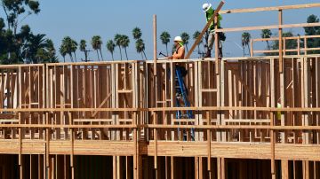 Constuction workers work on site of a new building in Los Angeles, California on October 8, 2019. - California Governor Gavin Newsom will sign into law California's "anti-rent gouging" bill capping rent increases to prevent price-gouging and landlord evictions amid California's rising homeless crisis but critics say the rent caps do not solve the long-term shortage of affordable housing. (Photo by Frederic J. BROWN / AFP) (Photo by FREDERIC J. BROWN/AFP via Getty Images)