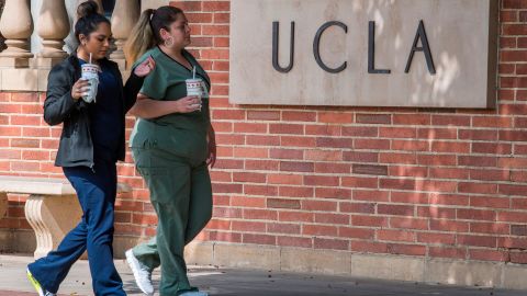 People walk through the campus of the UCLA college in Westwood, California on March 6, 2020. - Three UCLA students are currently being tested for the COVID-19 (coronavirus) by the LA Departement of Public Health, according to the UCLA Chancellor Gene Block. (Photo by Mark RALSTON / AFP) (Photo by MARK RALSTON/AFP via Getty Images)