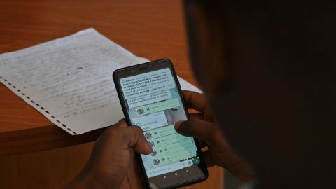 A teacher teaches and shares lessons with students via Whatsapp in the district of Port Bouet in Abidjan on April 21, 2020. - A group of private college teachers teaches free lessons with students after the Ivorian Ministry of National Education initiated on April 9, 2020, teaching on television for primary and secondary school children following the closure of schools in the country following the outbreak of the COVID-19 coronavirus. (Photo by ISSOUF SANOGO / AFP) (Photo by ISSOUF SANOGO/AFP via Getty Images)