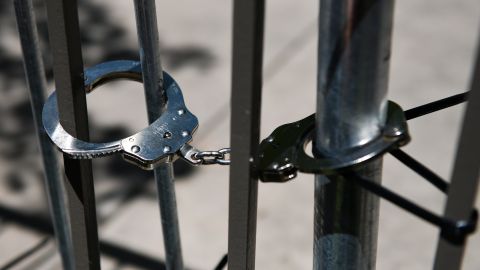 AURORA, CO - JUNE 27: Handcuffs hold barricades together at a rally outside the Aurora Police Department Headquarters to demand justice for Elijah McClain on June 27, 2020 in Aurora, Colorado. On August 24, 2019 McClain was walking home when he was forcibly detained by three Aurora police officers and was injected with ketamine after officers requested assistance from the Aurora Fire Rescue. McClain suffered a heart attack on the way to the hospital that night and died six days later. (Photo by Michael Ciaglo/Getty Images)