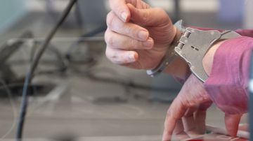 The defendant, who is accused to have shot in 2021 an employee of a gas station, wears handcuffs as he arrives for the continuation of his trial at the courtroom in Bad Kreuznach, western Germany, on March 25, 2022. - The man accused of killing a gas station employee who asked him to wear an anti-Covid mask started on March 21, 2022 in court in Bad Kreuznach. The defendant is suspected of shooting the 20-year-old cashier at a gas station in Idar-Oberstein (Rhineland-Palatinate) on September 18, 2021, as he was paying. (Photo by Sebastian Gollnow / POOL / AFP) (Photo by SEBASTIAN GOLLNOW/POOL/AFP via Getty Images)