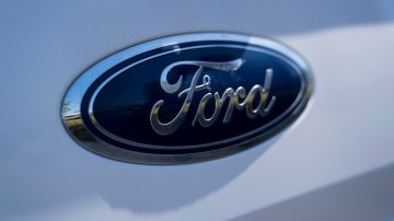 LONG BEACH, CA - SEPTEMBER 23: The blue Ford emblem is seen on a new car at a dealership on September 23, 2022 in Long Beach, California. Ford Motor Co. has reportedly delayed deliveries on some new vehicles due to a supply-chain shortage of the company's iconic blue badges. (Photo by Eric Thayer/Getty Images)