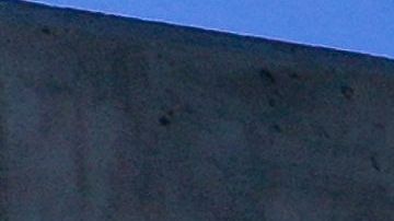 An aerial image taken on February 8, 2023 shows vehicles driving across the 6th Street Viaduct towards the downtown Los Angeles skyline in Los Angeles, California. - The $588-million bridge spans across the Los Angeles River to connect the Arts District with the Boyle Heights neighborhood east of downtown and became a popular location for street racing and daredevil social media activity, requiring additional fencing and traffic enforcement. (Photo by Patrick T. Fallon / AFP) (Photo by PATRICK T. FALLON/AFP via Getty Images)