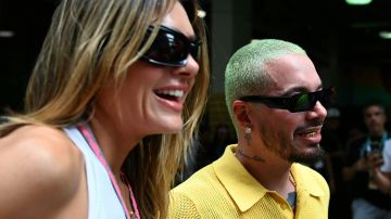 Colombian singer J Balvin (R), with Argentinian model Valentina Ferrer, stands for a photo while attending the 2023 Miami Formula One Grand Prix at the Miami International Autodrome in Miami Gardens, Florida, on May 7, 2023. (Photo by CHANDAN KHANNA / AFP) (Photo by CHANDAN KHANNA/AFP via Getty Images)