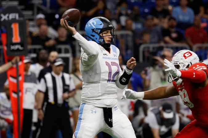 SAN ANTONIO, TX - MAY 13 : Luis Perez #12 of the Arlington Renegades looks to make a pass against DC Defenders during the first half of XFL Championship game at the Alamodome on May 13 2023 in San Antonio, Texas. (Photo by Ronald Cortes/Getty Images)