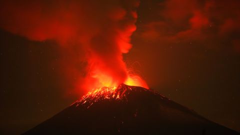 Incandescent materials, ash and smoke are spewed from the Popocatepetl volcano as seen from the San Nicolas de los Ranchos community, state of Puebla, Mexico, on May 23, 2023. Mexican authorities on May 21 raised the warning level for the Popocatepetl volcano to one step below red alert, as smoke, ash and molten rock spewed into the sky posing risks to aviation and far-flung communities below. Sunday's increased alert level -- to "yellow phase three" -- comes a day after two Mexico City airports temporarily halted operations due to falling ash. (Photo by Rafael Duran / AFP) (Photo by RAFAEL DURAN/AFP via Getty Images)