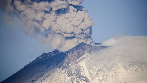 TOPSHOT - Ash and smoke billow from the Popocatepetl volcano as seen from the Santiago Xalitzintla community, state of Puebla, Mexico, on May 24, 2023. The Popocatepetl volcano, located around 70 kilometres (about 45 miles) from Mexico City, spewed more gas and ash into the sky on May 23 as authorities maintained their warning level at one step below red alert. The government is monitoring Popocatepetl "day and night," President Andres Manuel Lopez Obrador said after the volcano put on another fiery show overnight. (Photo by CLAUDIO CRUZ / AFP) (Photo by CLAUDIO CRUZ/AFP via Getty Images)