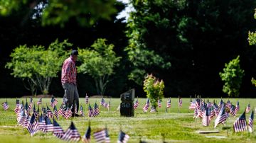 A man visits the Eastern Shore Veterans Cemetery in Hurlock, Maryland, on May 27, 2023, ahead of the Memorial Day holiday. (Photo by Jim WATSON / AFP) (Photo by JIM WATSON/AFP via Getty Images)