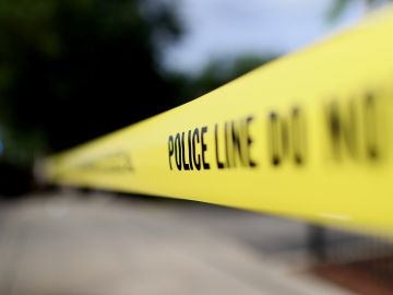 CHICAGO, ILLINOIS - JUNE 23: Police tape surrounds a crime scene where three people were shot at the Wentworth Gardens housing complex in the Bridgeport neighborhood on June 23, 2021 in Chicago, Illinois. A 24-year-old man died from injuries he suffered in the shooting and two others, a 22-year-old male and a 25-year-old male, were seriously wounded. (Photo by Scott Olson/Getty Images)